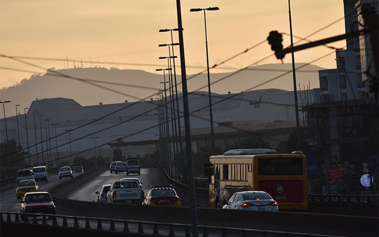 Picture shows a road situation with beautiful view ,arabic translation abu dhabi driving license